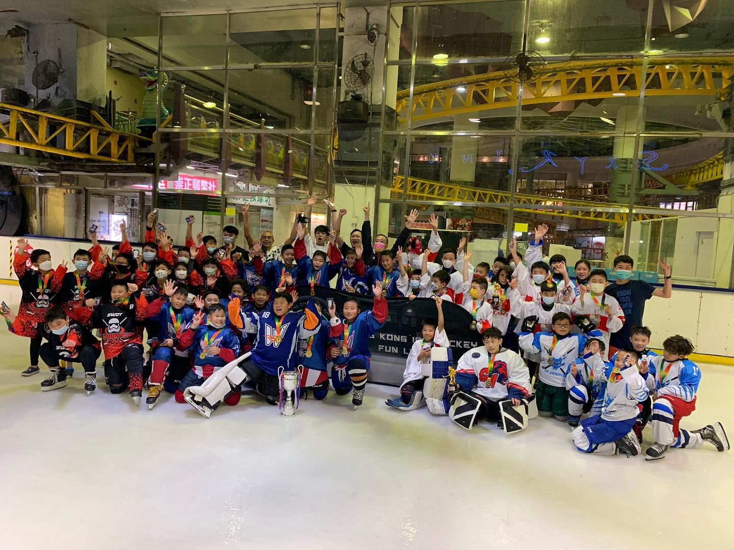 Fun League Hockey Club kids celebrating on the ice