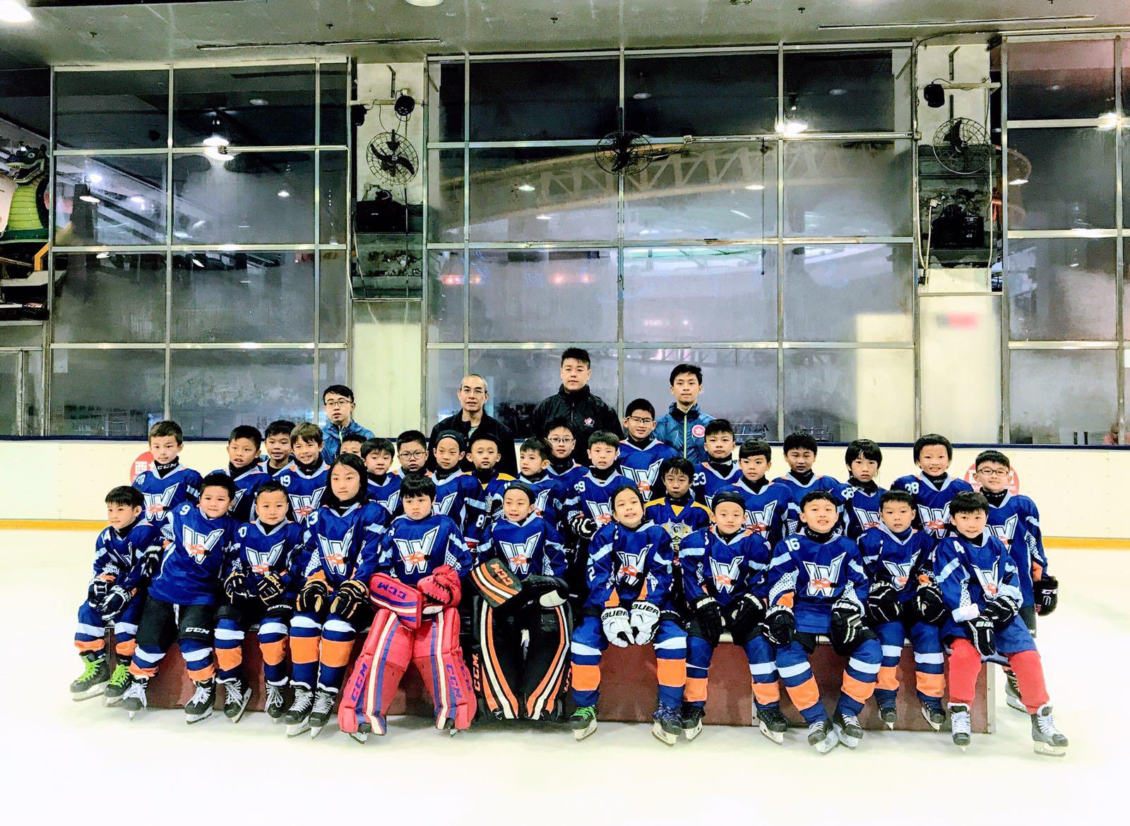 Full squad of young players posing after practice